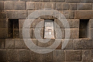 The three trapezoidal windows and Inca Wall of Rainbow Temple at Qoricancha Inca Ruins - Cusco, Peru photo