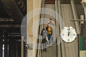 Three travelers go down to the platform area, Zaragoza