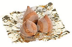 Three truffles on foil