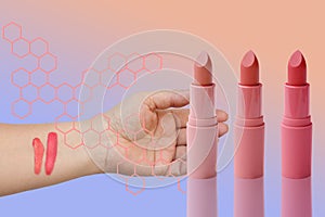 Three tubes of lipstick and two abstract strokes on the female hand of pink, natural color, sample color matching makeup, the