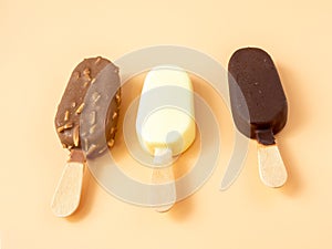 Three types of ice cream on a stick.