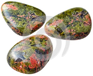 Three Unakite gemstones isolated on white photo