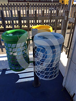 Three urban waste bins for the separate collection of waste.