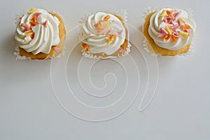 Three vanilla cupcakes