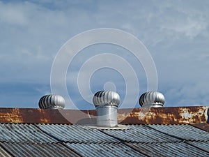 Three ventilators on a roof