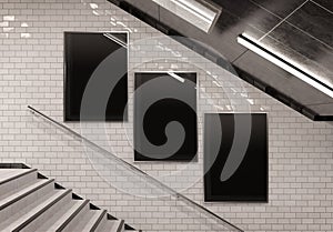 Three vertical billboards on underground stairs wall Mockup. Triptych hoardings advertising in white tiles tunnel interior. 3D