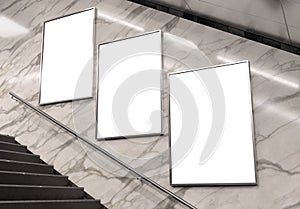 Three vertical billboards on underground subway wall Mockup. Hoardings advertising triptych on train station 3D rendering