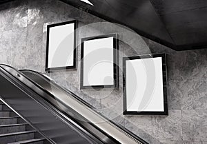 Three vertical billboards on underground wall Mockup. Hoardings advertising triptych on subway wall 3D rendering