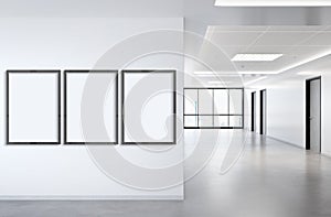 Three vertical frames Mockup hanging on wall. Mock up of billboards in modern concrete office interior 3D rendering