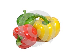 Three vibrant color bell peppers, one ed, one yellow and one green isolated on white background