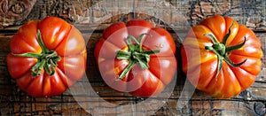 Three Vibrant Organic Brandywine Tomatoes on Wooden Table