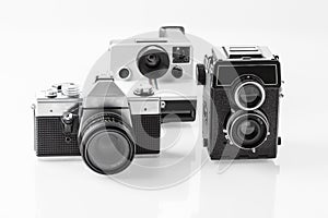 Three vintage analogue cameras