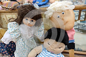 Three Vintage Dolls in a Thrift Store