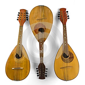 Three vintage mandolins. Isolated on a white background.
