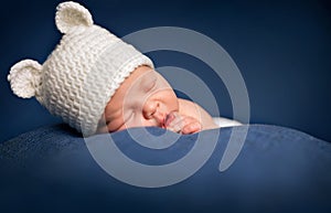 Three week old newborn baby boy sleeping