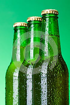 Three wet blank beer bottles