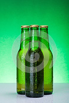 Three wet blank beer bottles