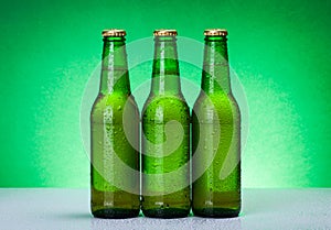 Three wet blank beer bottles