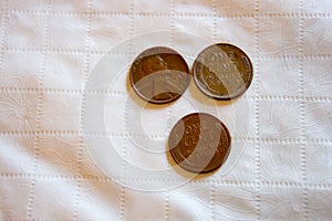 Three wheat pennies on a white table cloth