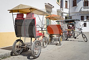 Three wheeled bicycles in Old Havana