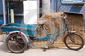 Three wheeled bike for sale in an alley in Beijing.