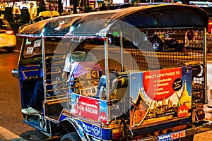 Three wheeled Tuk Tuk taxi on the streets of Bangkok, Thailand, 2019