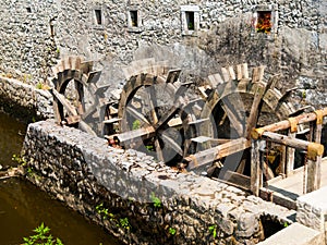 Three wheeled wooden mill