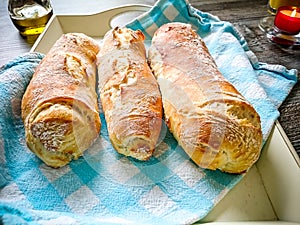 Three white bread baguett with olive oil