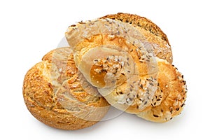 Three white bread rolls isolated on white. Round rustic, plaited with salt and caraway seeds and french