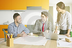 Three white businessmen working on project