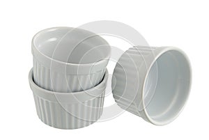 Three white ceramic individual baking pans