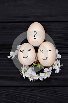 Three white eggs symbolize mother, father and child. Pregnancy test