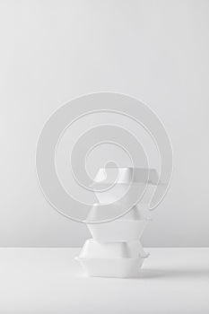 three white food containers