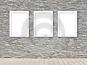 Three white frame templates on a decorative stone wall design mockup