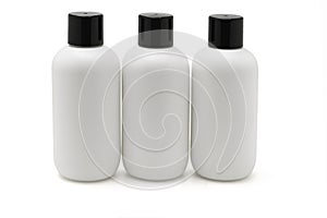 Three white plastic bottles