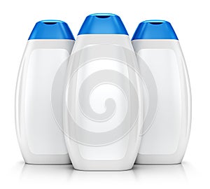 Three white plastic bottles of shampoo