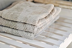 White towels piled in a sink.
