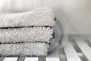 White towels piled in a sink.