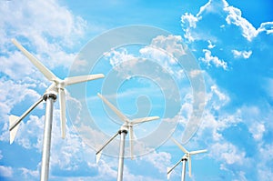 Three white wind turbine generating electricity