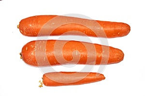 Three whole carrots isolated on a white background. Isolate. Food background.