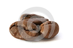 Three whole coffee beans detail