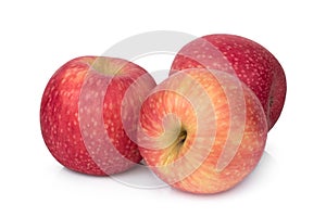 Three whole pink lady apple isolated on white