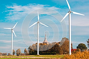 Three wind farms and church photo