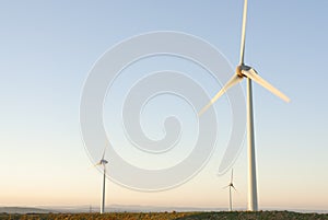 Three Wind Turbines at Dawn, UK.