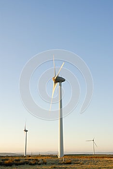 Three Wind Turbines at Dawn, UK.