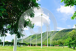 Three wind turbines farm on mountain in rural area. The clean energy system