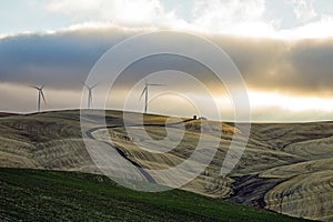 Three  Wind Turbines under a cloudy sky on the Palouse, Washington State