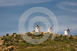 Three windmills on a mountain top photo