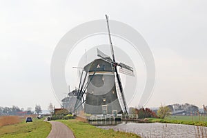 Three windmills in a row in the Driemanspolder at Stompwijk the Netherlands