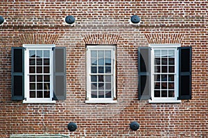 Three windows of an old american building